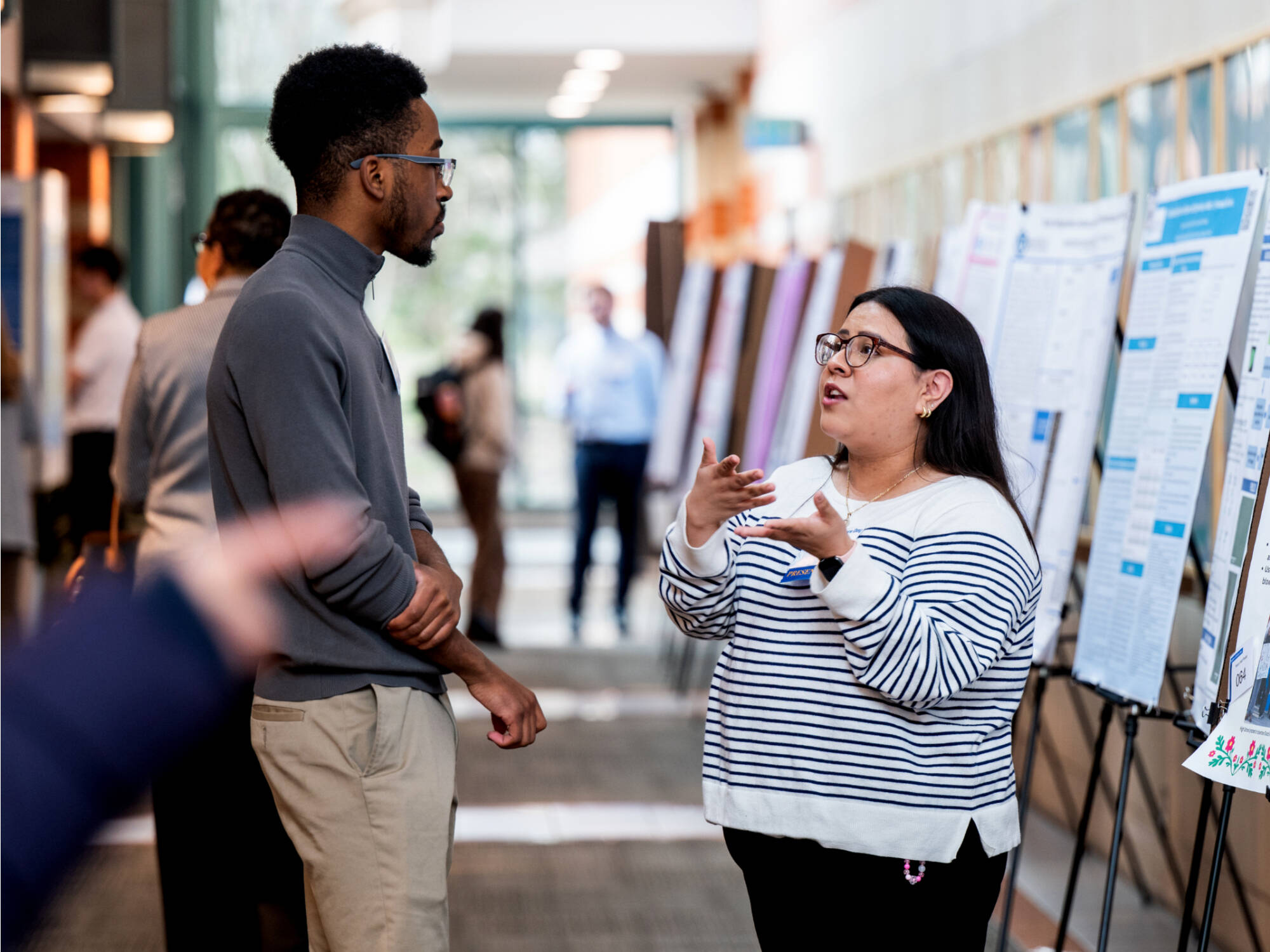 two people networking at a GVSU event